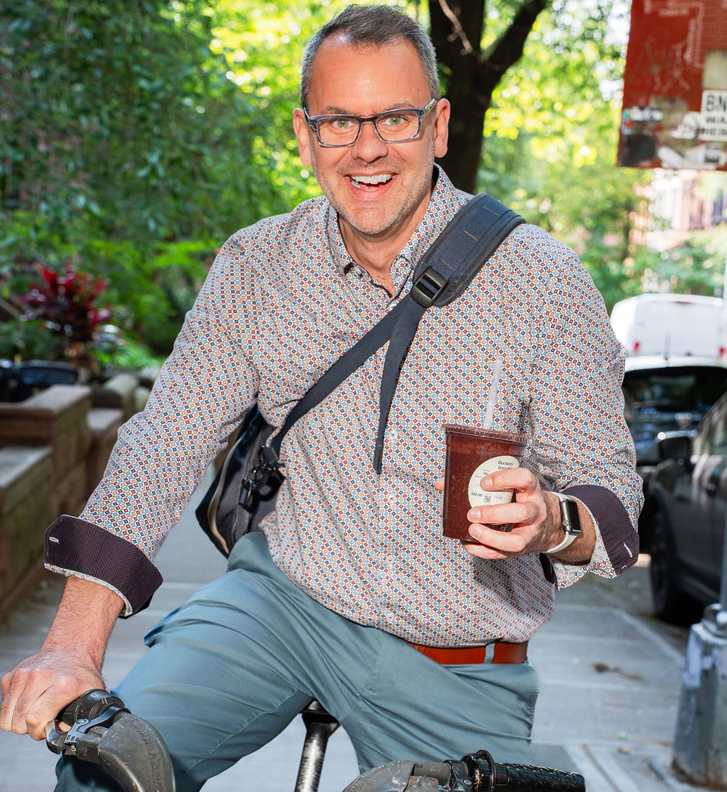 Lifestyle Photo Michael on a bike with smoothie