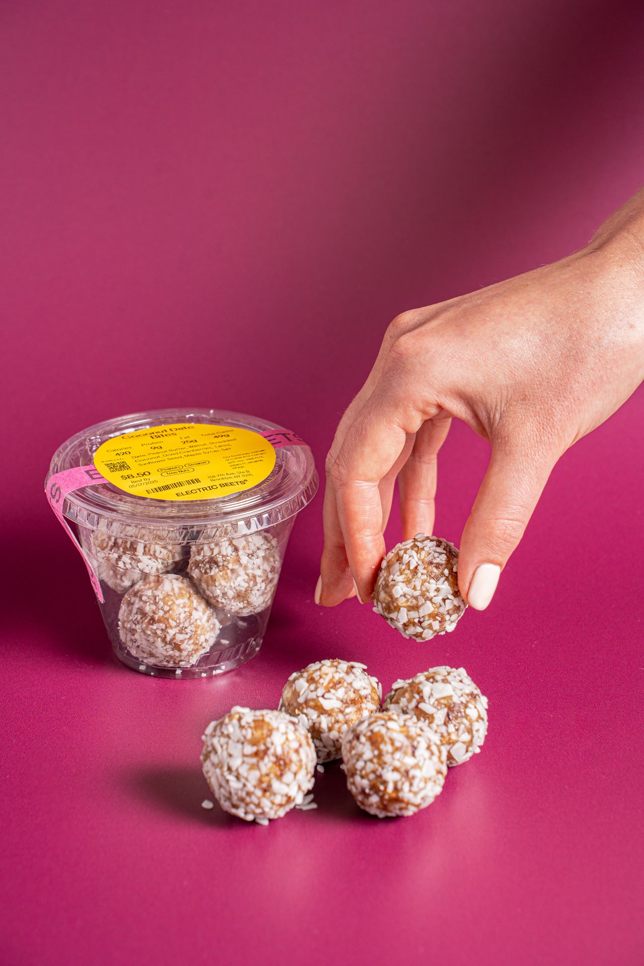 Coconut Date Bites; Baked & Sweets, Snacks; Date, Peanut Butter, Walnut, Shredded Coconut, Dried Cranberry, Tahini, Sunflower Seed, Maple Syrup, Salt; Contains Peanuts, Tree Nuts, Sesame; Chewy dates, creamy peanut butter, and coconut—because clearly, ordinary snacks just wouldn’t cut it.