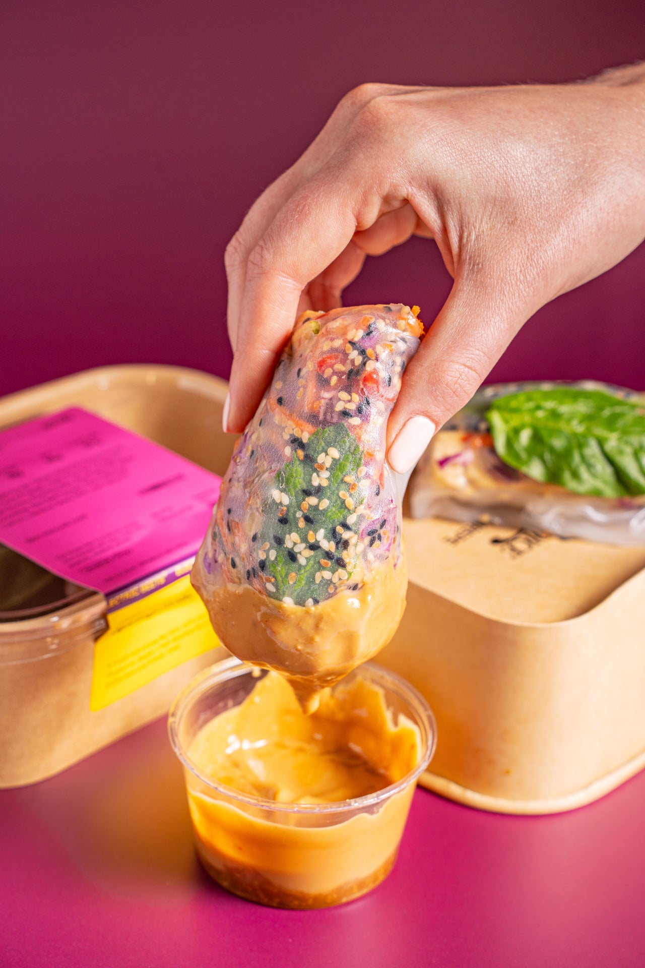 Spring Rolls; Hand Helds; Tofu (Maple Syrup, Tamari, Avocado Oil, Nutritional Yeast, Onion, Garlic, Oregano), Sweet Potato Noodles, Rice Paper Wrapper (Rice, Tapioca), Cucumber, Red Bell Pepper, Red Cabbage, Carrots, Sesame Seed, Mint Leaf, Spinach; Choice of Sauce; Contains Sesame, Soy; A fresh roll of perfection, with your choice of Peanut or Sweet Chili dipping sauce! The healthiest addiction you'll ever have.