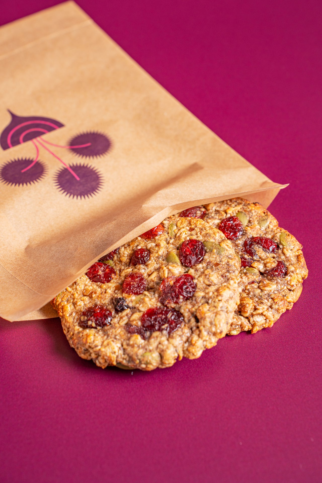 Energy Cookie; Baked & Sweets, Snacks; Date, GF Rolled Oats, Tahini, Pumpkin Seed, Cranberries, Chia, Flax, Vanilla, Salt, Cinnamon, Baking Soda, Baking Powder; Contains Sesame; Packed with seeds, oats, and tahini—because your treat should work as hard as you do.