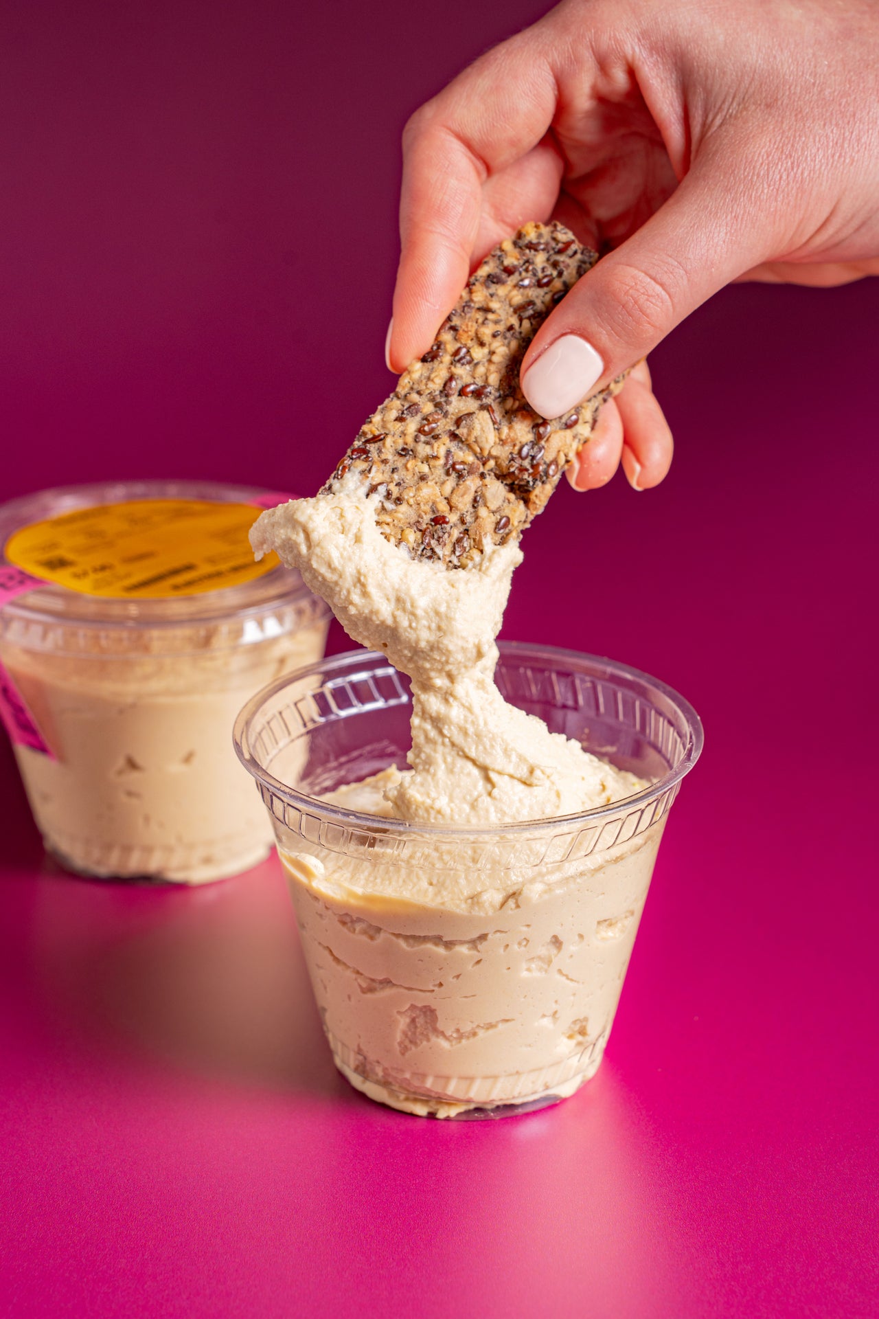 Hummus; Snacks; Chickpeas, Tahini, Lemon, Water, Olive Oil, Garlic, Salt; Contains Sesame; Perfect for dipping, spreading, or dolloping.