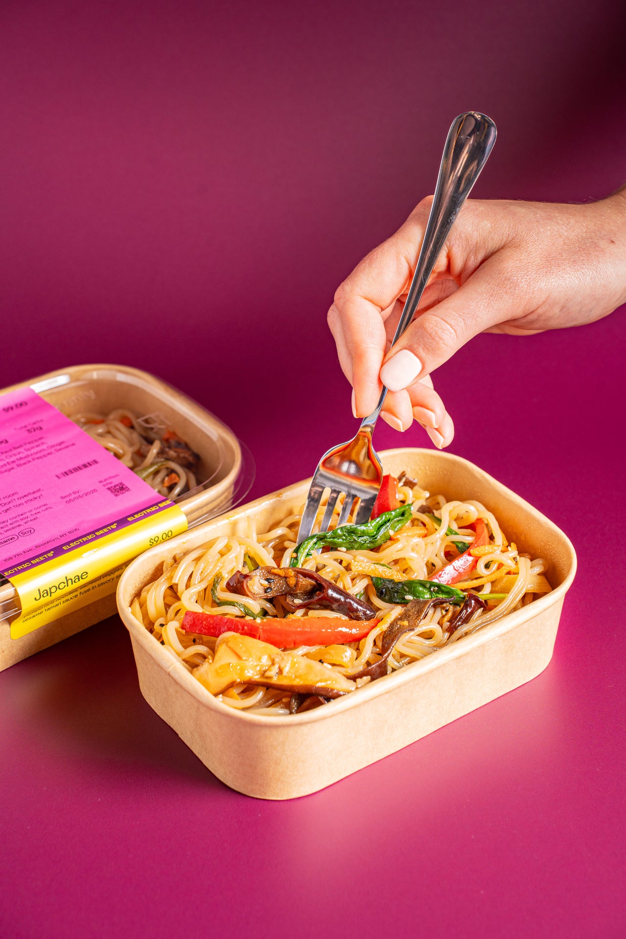 Japchae; Noodles; Sweet Potato Rice Noodles, Red Bell Pepper, Carrots, Shiitake Mushroom, Onion, Spinach, Scallion, Sesame Oil, Wood Ear Mushroom, Ginger, Tamari, Coconut Palm Sugar, Black Pepper, Sesame Seeds; Contains Sesame, Soy; Sweet potato rice noodles, sautéed veggies, and a light sesame tamari sauce come together in savory satisfaction!