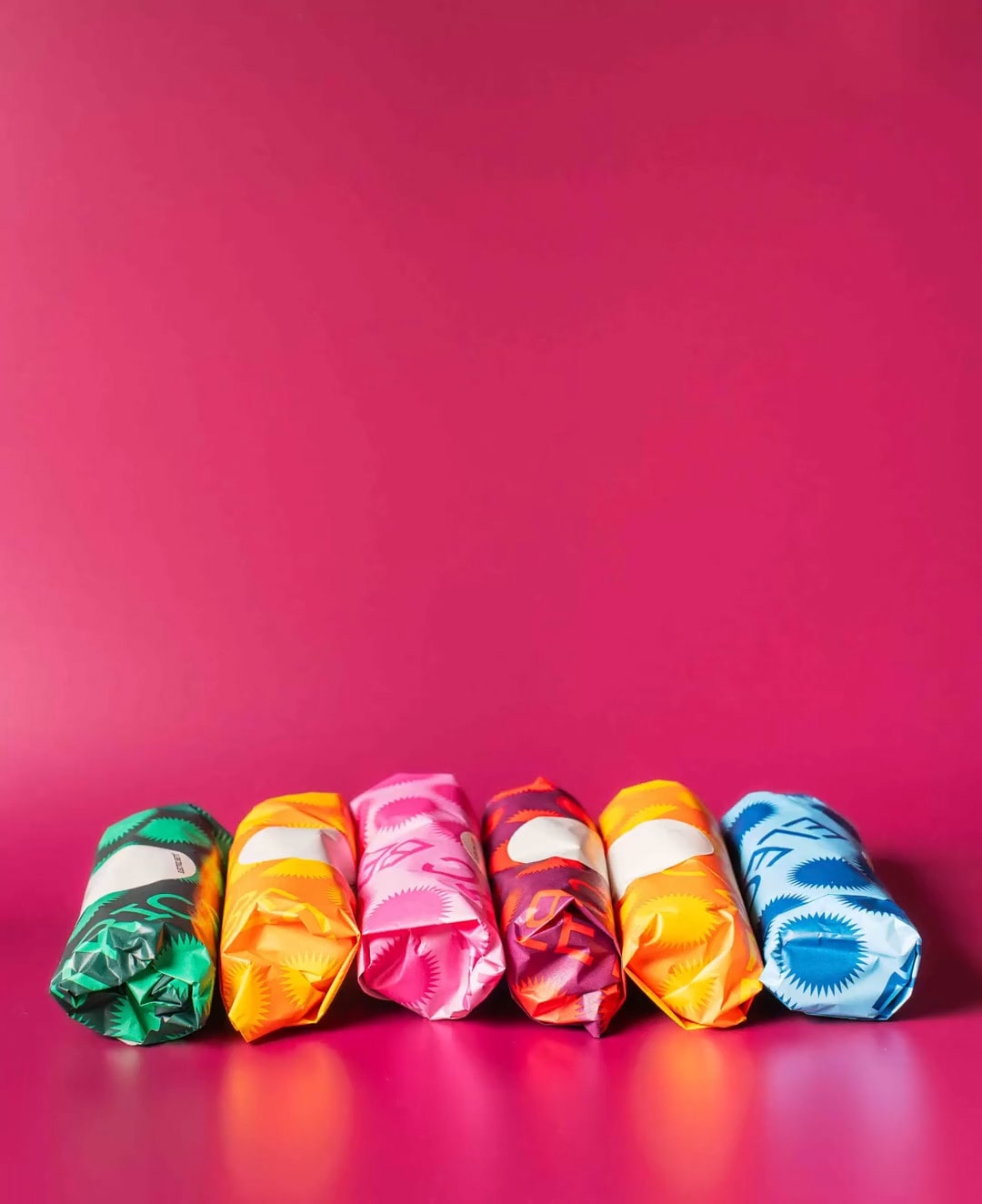 Burrito pyramid gif, multi-colored burrito wrappers, Electric Beets branded